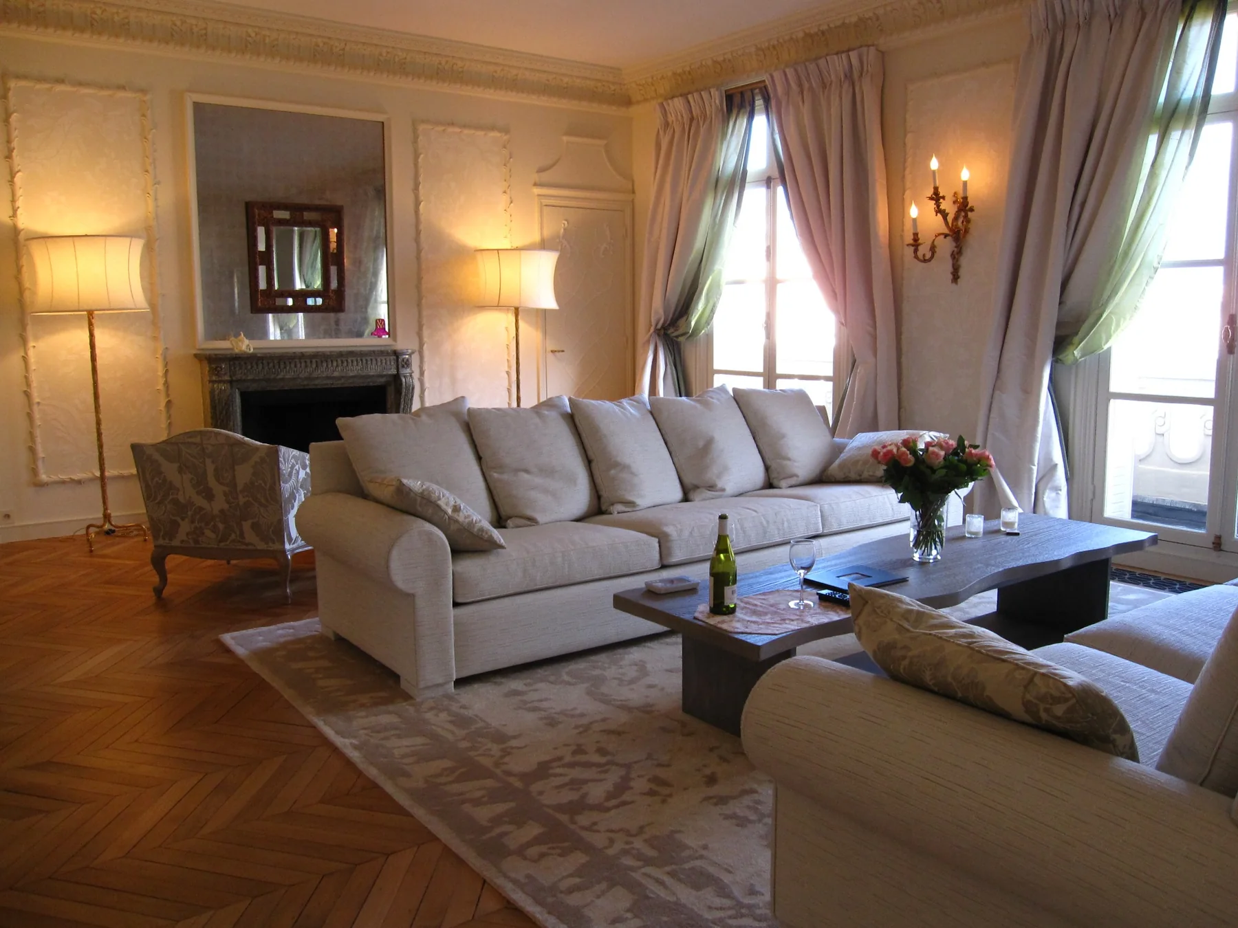 Elegant European apartment living room with contemporary upholstered furniture and classical detailing