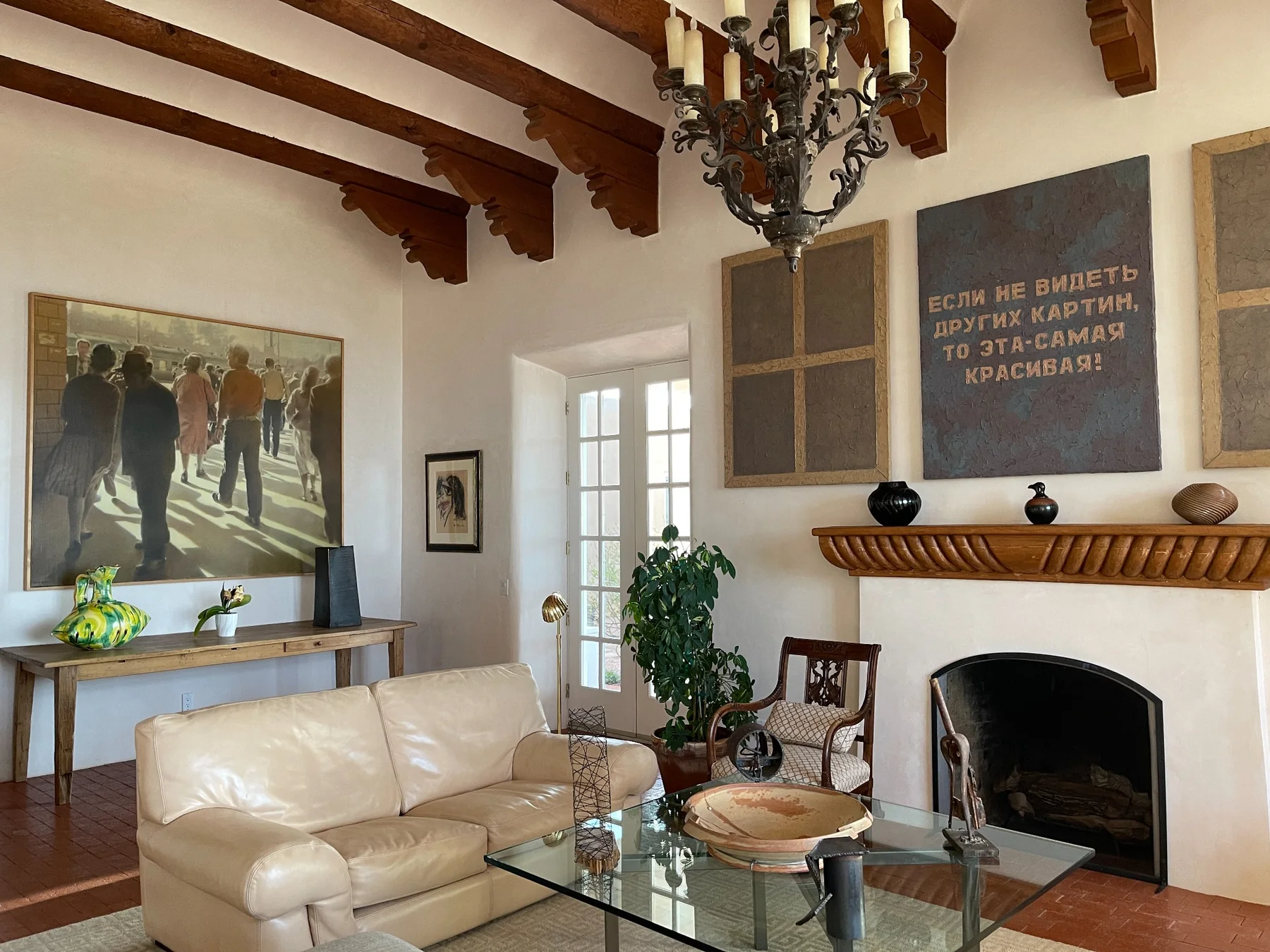 Historic Santa Fe residence with fireplace, artwork, sculpture, and vigas
